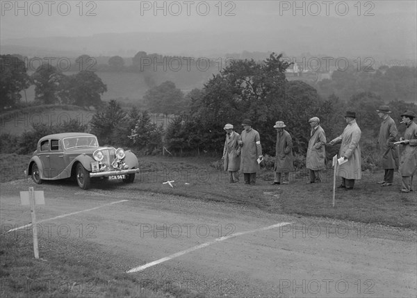 Jaguar SS saloon of BA Hickman competing in the South Wales Auto Club Welsh Rally, 1937 Artist: Bill Brunell.