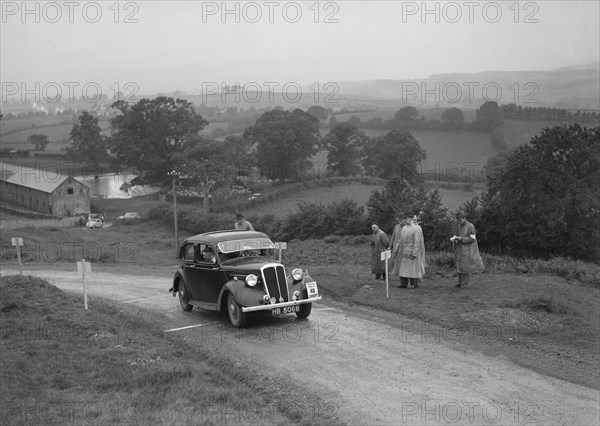 Standard 12 saloon of Miss I Webber competing in the South Wales Auto Club Welsh Rally, 1937 Artist: Bill Brunell.