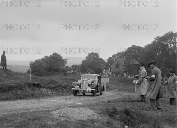 Jaguar SS saloon of HT Lewis competing in the South Wales Auto Club Welsh Rally, 1937 Artist: Bill Brunell.