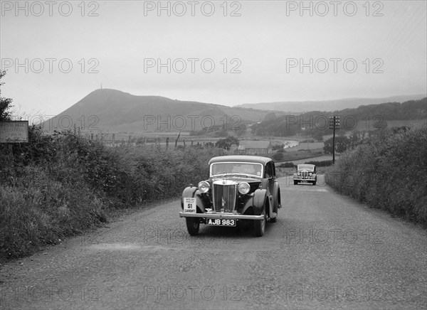 MG VA of RK Wellsteed ahead of a Wolseley saloon at the South Wales Auto Club Welsh Rally, 1937 Artist: Bill Brunell.