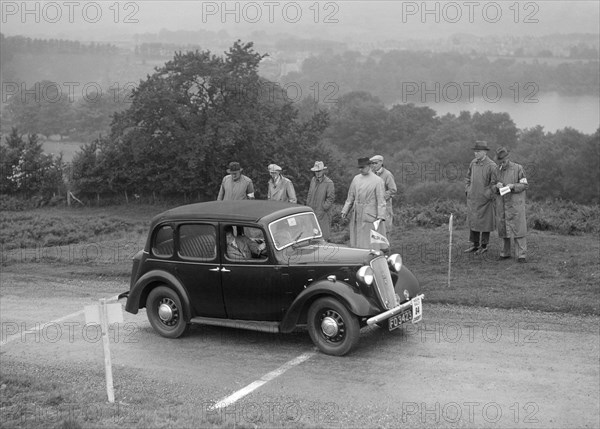 Austin Cambridge saloon of T Norton competing in the South Wales Auto Club Welsh Rally, 1937 Artist: Bill Brunell.