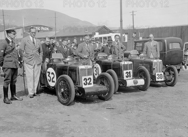 Three MG C type Midgets at the RAC TT Race, Ards Circuit, Belfast, 1932. Artist: Bill Brunell.