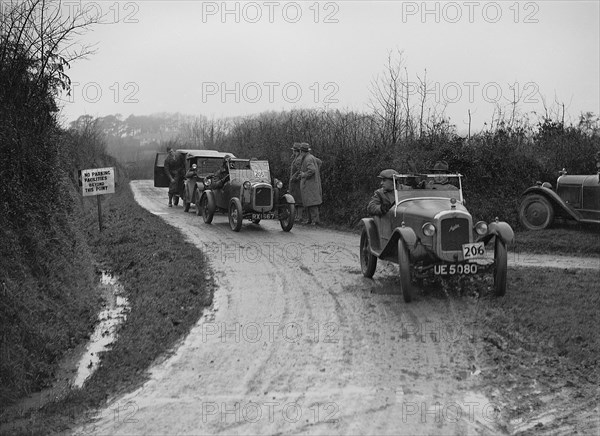 Austins of WCH Pitts and JC Thorowgood competing in the MCC Exeter Trial, 1928. Artist: Bill Brunell.