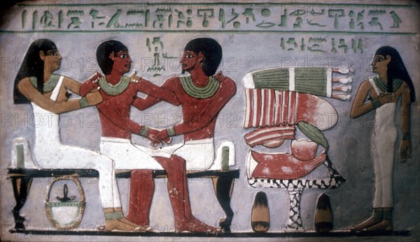 Relief of Imn-Hat seated with his wife & son in front of an offering, Thebes, c2050-c1786 BC. Artist: Unknown