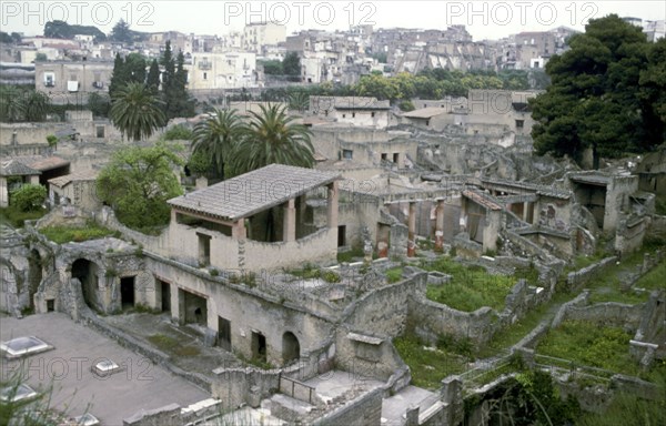 Buildings of Herculaneum with houses of the modern town of Ercolano above, Italy. Artist: Unknown
