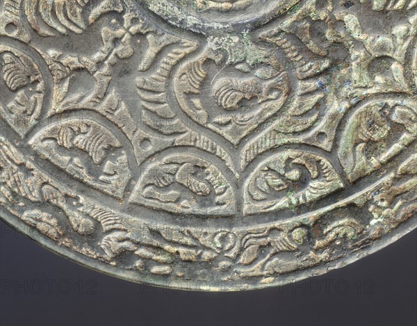 Bronze mirror with dragon and phoenix design, early Six Dynasties period, China, mid 3rd century. Artist: Unknown