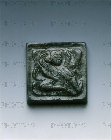 Mottled black jade square belt plaque with drummer in relief, Tang dynasty, China, 618-907. Artist: Unknown