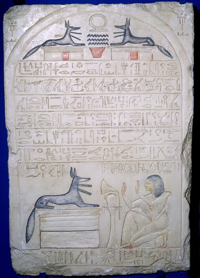 Egyptian elief stele of a man adoring Anubis. Artist: Unknown