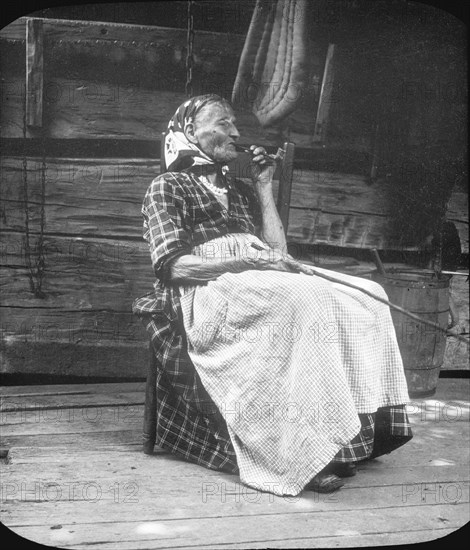 Old woman smoking a pipe, Appalachia, USA, c1917. Artist: Cecil Sharp