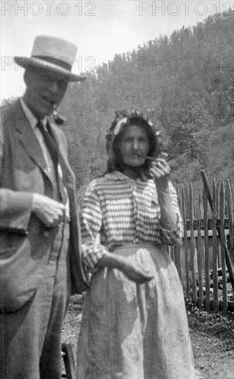 Cecil Sharp and Aunt Betsy smoking pipes, Appalachia, USA, c1917. Artist: Unknown