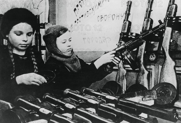 Young girls assembling machine guns in a Russian factory, 1943. Artist: Unknown