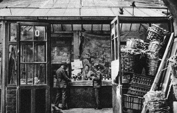 A bar in the Central Market quarter, Paris, 1931.Artist: Ernest Flammarion