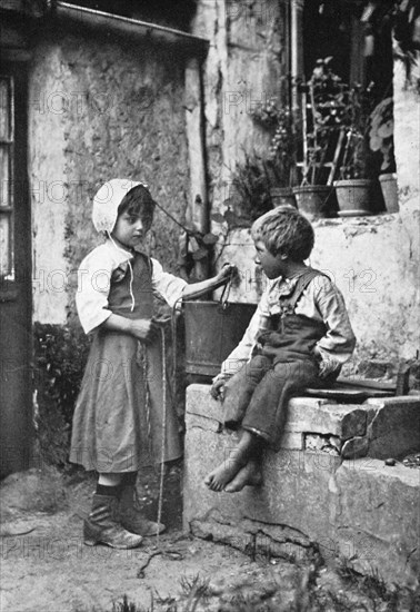 Two children in a backyard, 902-1903.Artist: Constance Ellis