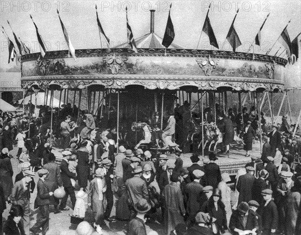 A merry-go-round, part of a bank holiday carnival on Hamstead Heath, London, 1926-1927. Artist: Unknown