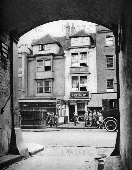 Old house and a tavern surviving in Aldgate, London, 1926-1927.Artist: McLeish