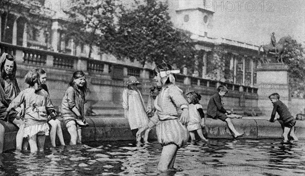 Children paddling in the fountains at Trafalgar Square, London, 1926-1927. Artist: Whiffin