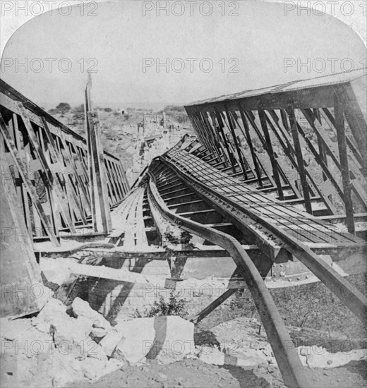 Railway bridge across the Vals River at Kroonstad, blown up by the Boers, South Africa, 1901. Artist: Underwood & Underwood