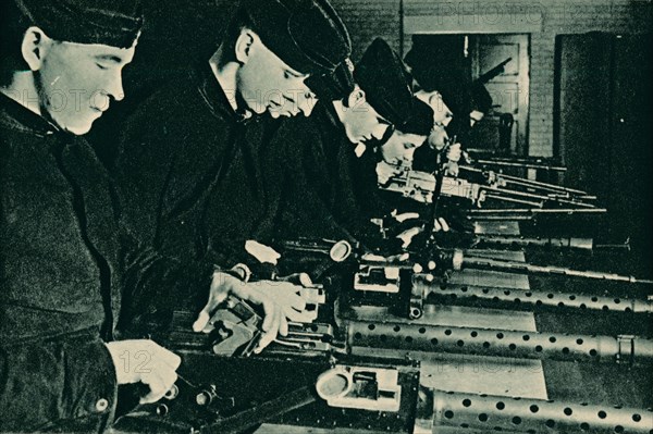 Armourers Assembling Aerial Guns, 1940. Artist: Unknown