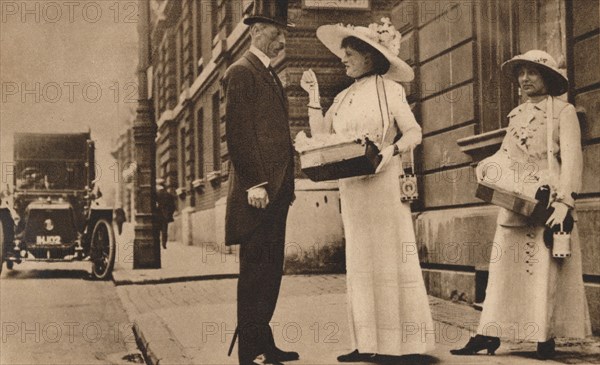 Lady Pilkington selling roses at the first anniversary of Alexandra Rose Day, 25 June, 1913 (1935). Artist: Unknown.