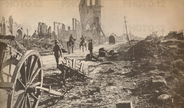 'The battered remains of Ypres after the last shell had done its worst, showing the ruins of the fam Artist: Unknown.