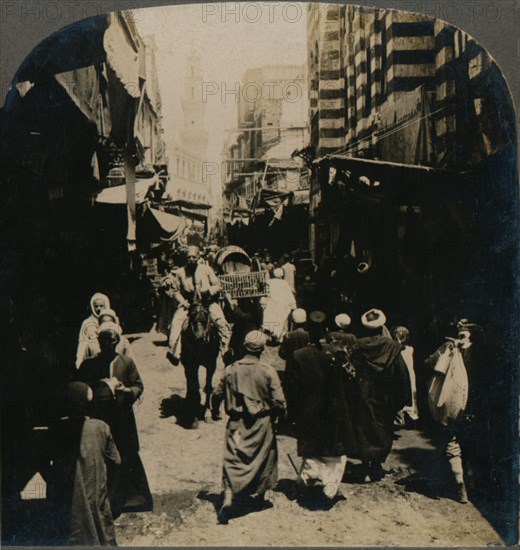 'On El Choir, a Narrow Street in the Arab Bazaar Quarter of Cairo, Egypt', 1903. Artist: Unknown.