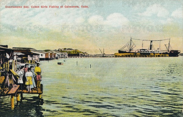 'Guantanamo Bay, Cuban Girls Fishing at Caimanera, Cuba', c1910. Artist: Unknown.