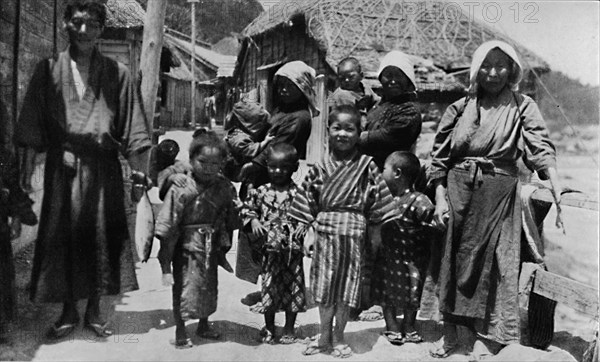 ''Large family of young fisherman at Nabuto, with nine children', c1900, (1921). Artist: Julian Leonard Street.