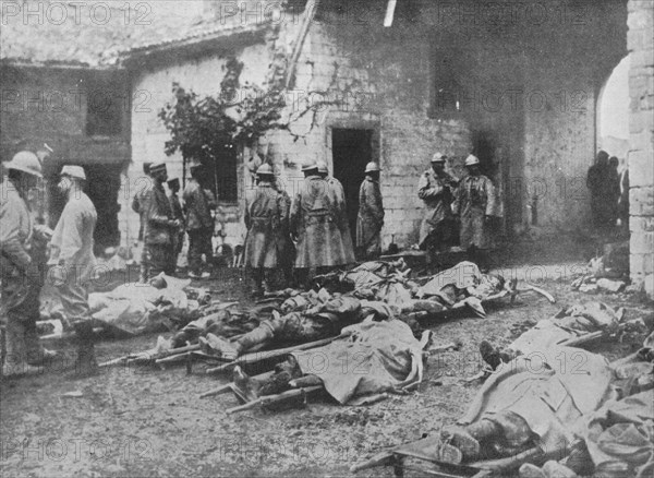 'French wounded being removed during an attack to a farm in the rear of the lines', 1915. Artist: Unknown.