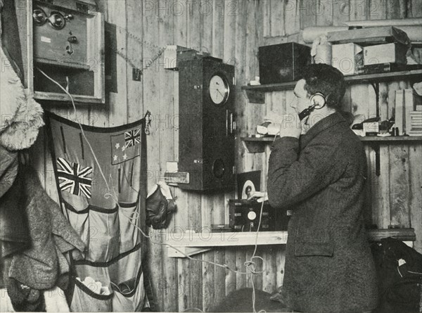 'Dr. Simpson in the Hut at the Other End of the Telephone Timing the Observation', c1911, (1913). Artist: Herbert Ponting.