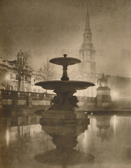 'Night Rain Has Turned The Pavements To A Pool of Reflections', c1935. Creator: Calkin.