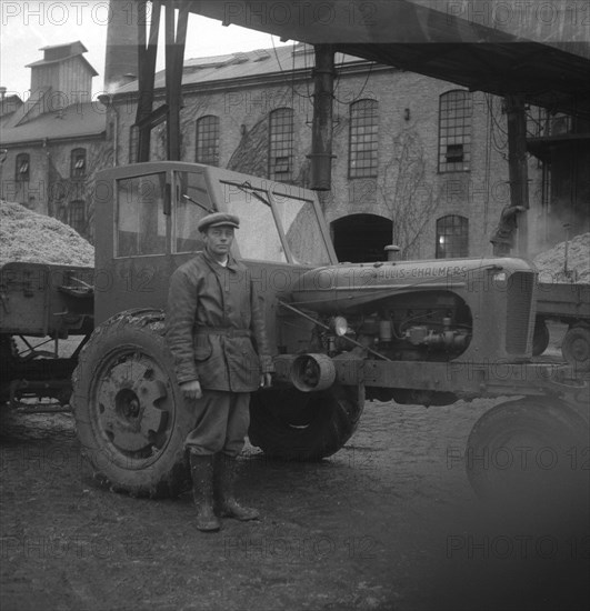 Man with a tractor at the sugar mill in Arlöv, Scania, Sweden, c1940s(?). Artist: Otto Ohm