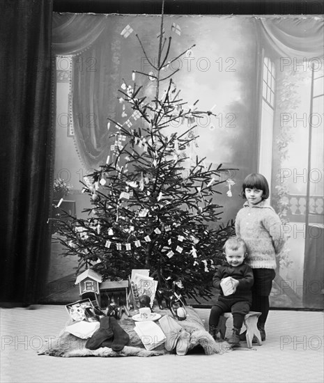 The photographer's children and their Christmas presents, Sweden. Artist: Unknown