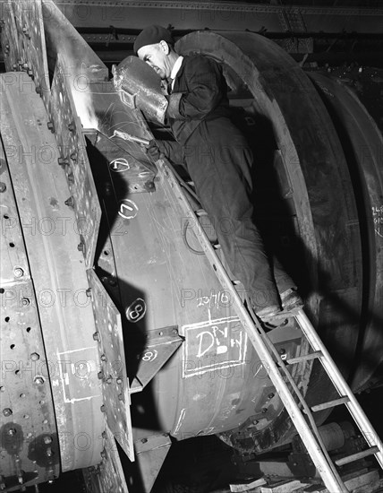 Welding an industrial drying unit, Edgar Allen Steel Co, Sheffield, South Yorkshire, 1962. Artist: Michael Walters