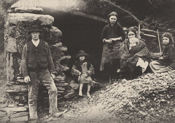 The Great Famine. A family at the ruins of their house in Killarney, 1888.