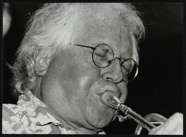 Trumpeter Henry Lowther playing at The Fairway, Welwyn Garden City, Hertfordshire, 1 October 2000. Artist: Denis Williams