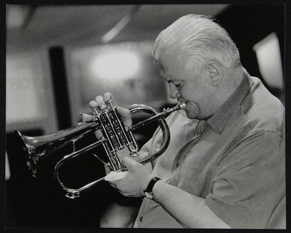 Bruce Adams playing the flugelhorn at The Fairway, Welwyn Garden City, Hertfordshire, 2 June 2002. Artist: Denis Williams