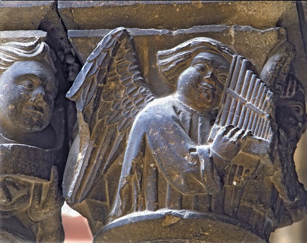 Capital of one of the Gothic galleries of the cloister built between (1387 - 1401) representing a?