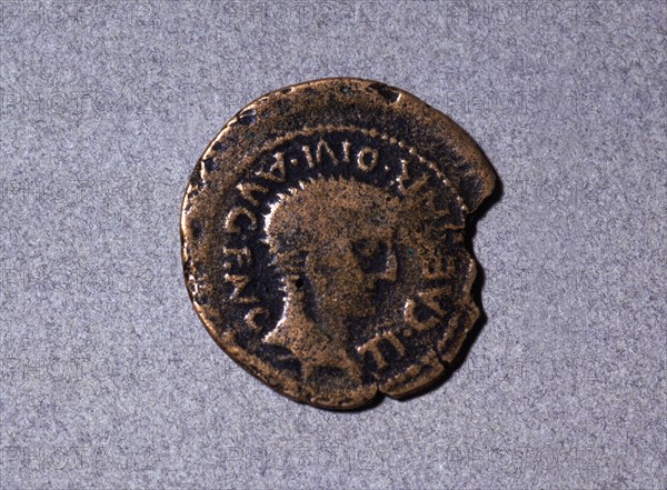Roman coin from the first half of the first century AC, with a head facing right and the legend '?