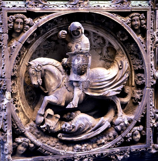 Sant Jordi medallion at the entrance of the Gothic façade of the Palace of the Generalitat of Cat?