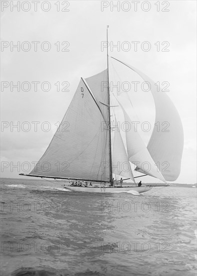 'Istria' sailing downwind under spinnaker, 1912.  Creator: Kirk & Sons of Cowes.