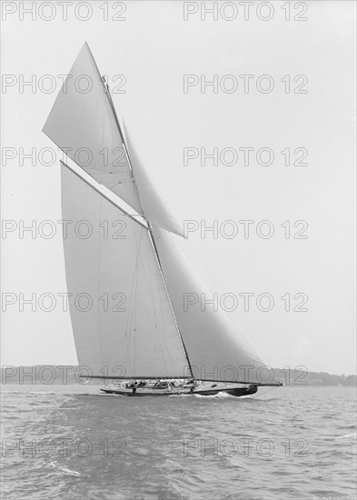 The towering 10,450 sq ft sail area of 'Shamrock IV', 1914. Creator: Kirk & Sons of Cowes.