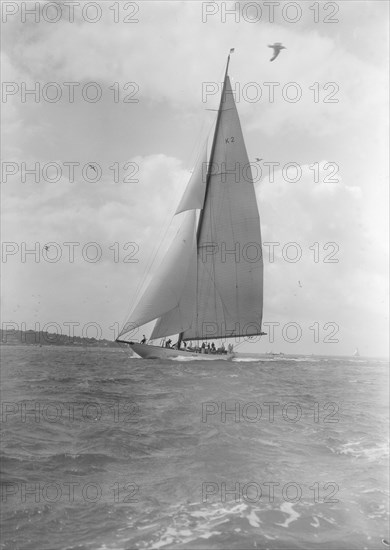 The 23-metre cutter 'Astra' sailing close-hauled, 1933. Creator: Kirk & Sons of Cowes.