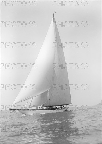 The 23-metre cutter 'Astra' sailing close-hauled, 1928. Creator: Kirk & Sons of Cowes.