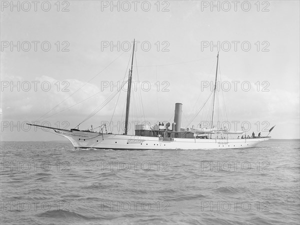 The 70 ton steam yacht 'Ombra' under way, 1914. Creator: Kirk & Sons of Cowes.