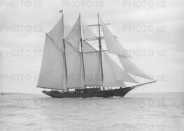 The auxiliary schooner 'La Cigale' sailing close-hauled, 1913. Creator: Kirk & Sons of Cowes.