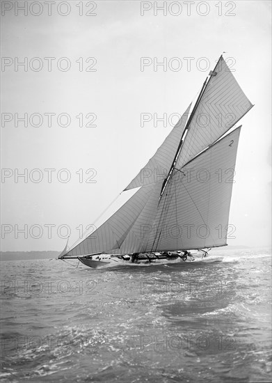 The 40-rater cutter 'Carina' sailing close-hauled, 1911. Creator: Kirk & Sons of Cowes.