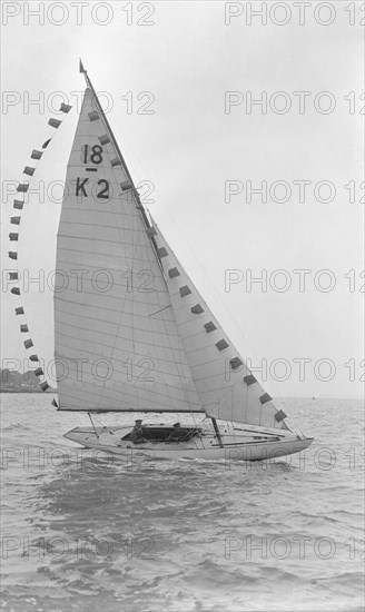 The 18-foot keelboat 'Prudence' (K2) with prize flags, 1922. Creator: Kirk & Sons of Cowes.