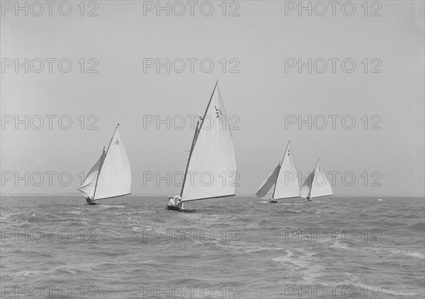 The 6 Metres boats 'Snowdrop', 'The Whim', 'Cheetal' and 'Ejnar' racing downwind. Creator: Kirk & Sons of Cowes.