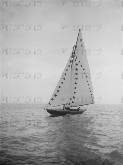 The 7 Metre sailing yacht 'Pinaster' (K8) with prize flags, 1912. Creator: Kirk & Sons of Cowes.