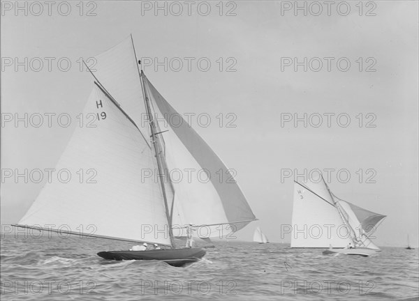 The 8 Metre 'Antwerpia' (H19) and 'Windflower' (H3) racing under spinnaker, 1911. Creator: Kirk & Sons of Cowes.